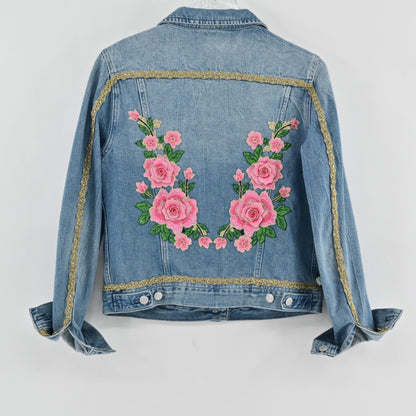 Lynn's Closet Boutique blue denim jacket with pink rose embroidery and gold metallic trim on the back