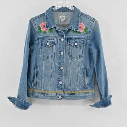 Lynn's Closet Boutique J.Crew blue denim jacket featuring pink rose embroidery and gold metallic trim at the hem.