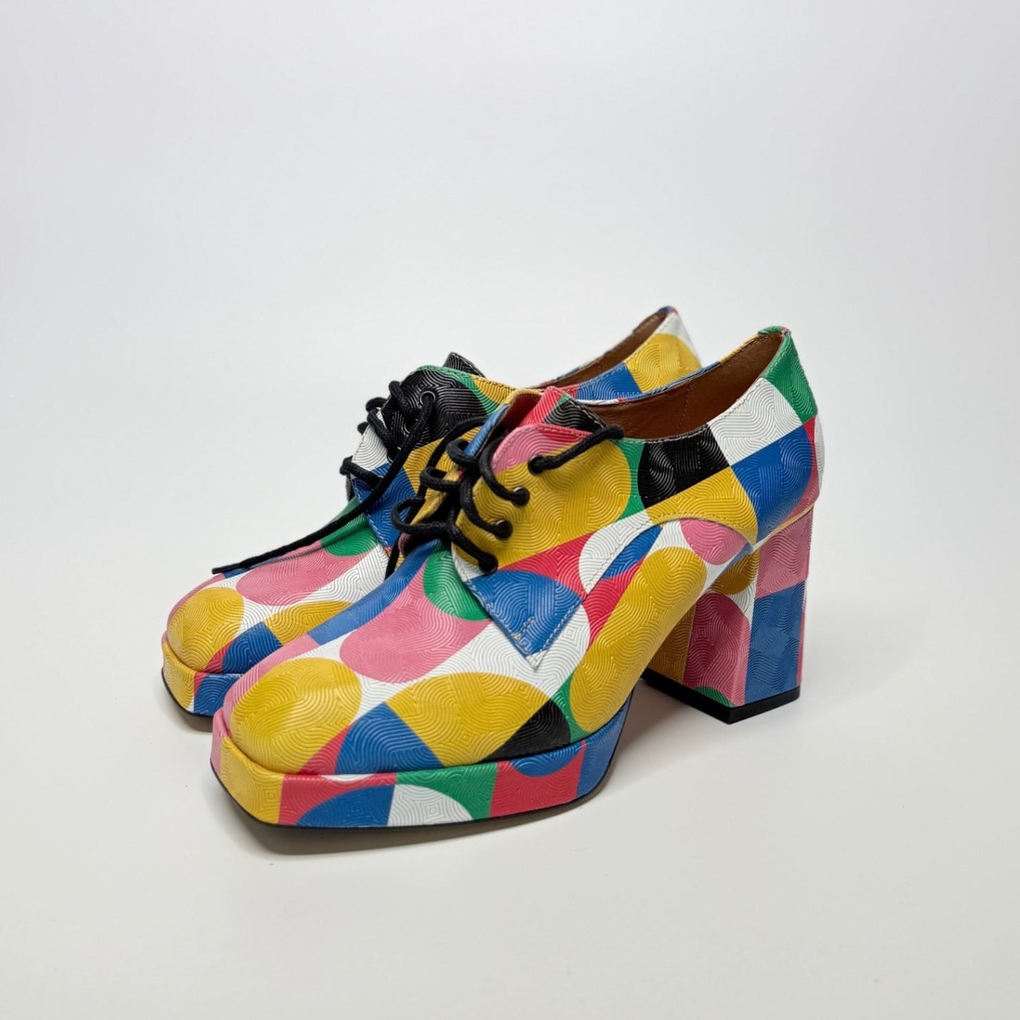 Lynn's Closet Boutique Embassy London Roulette platform lace-up shoes with a vibrant multi-colored geometric pattern.