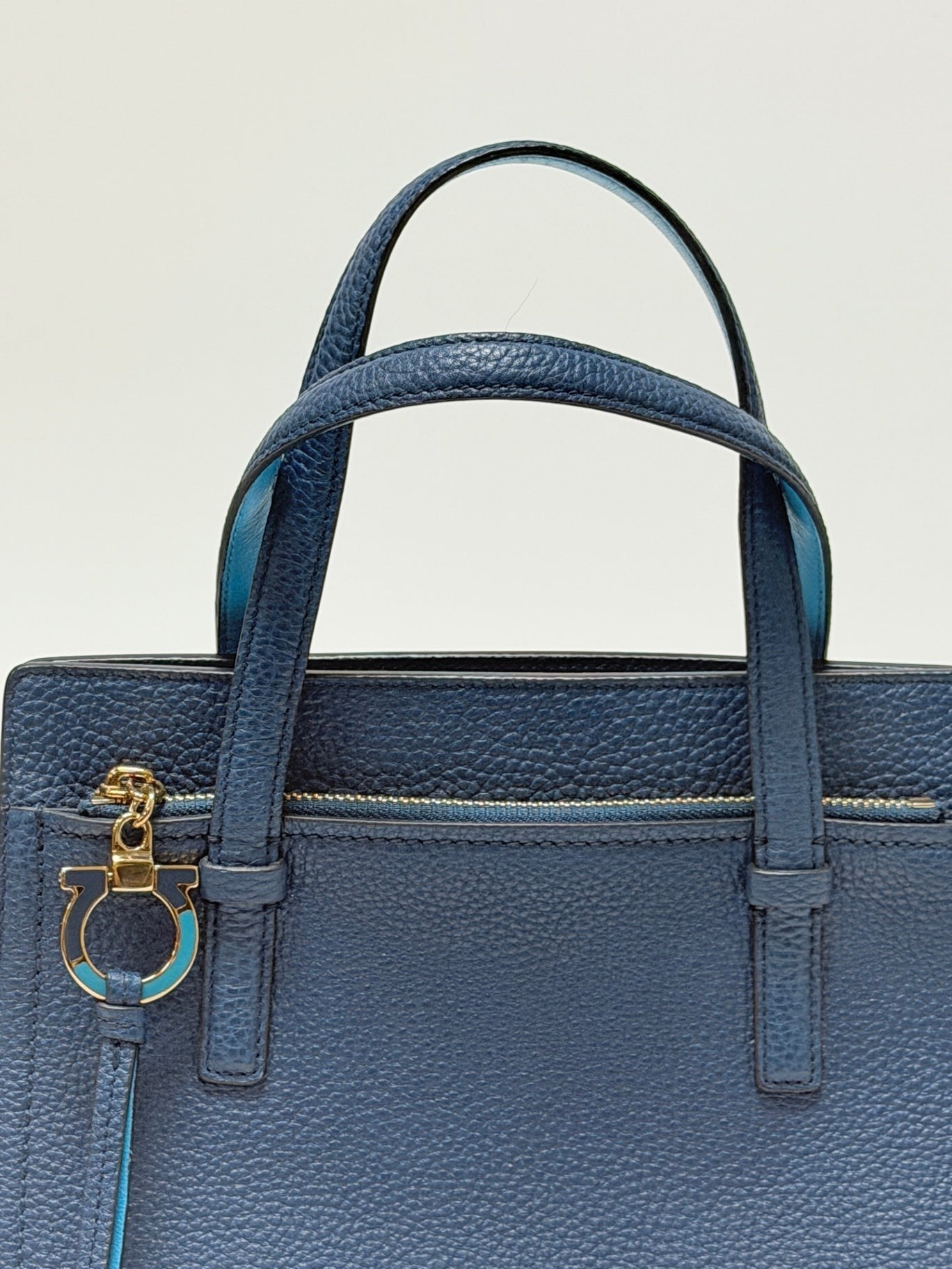 Lynn's Closet Boutique Salvatore Ferragamo Amy small blue pebbled leather tote bag with gold Gancini charm detail