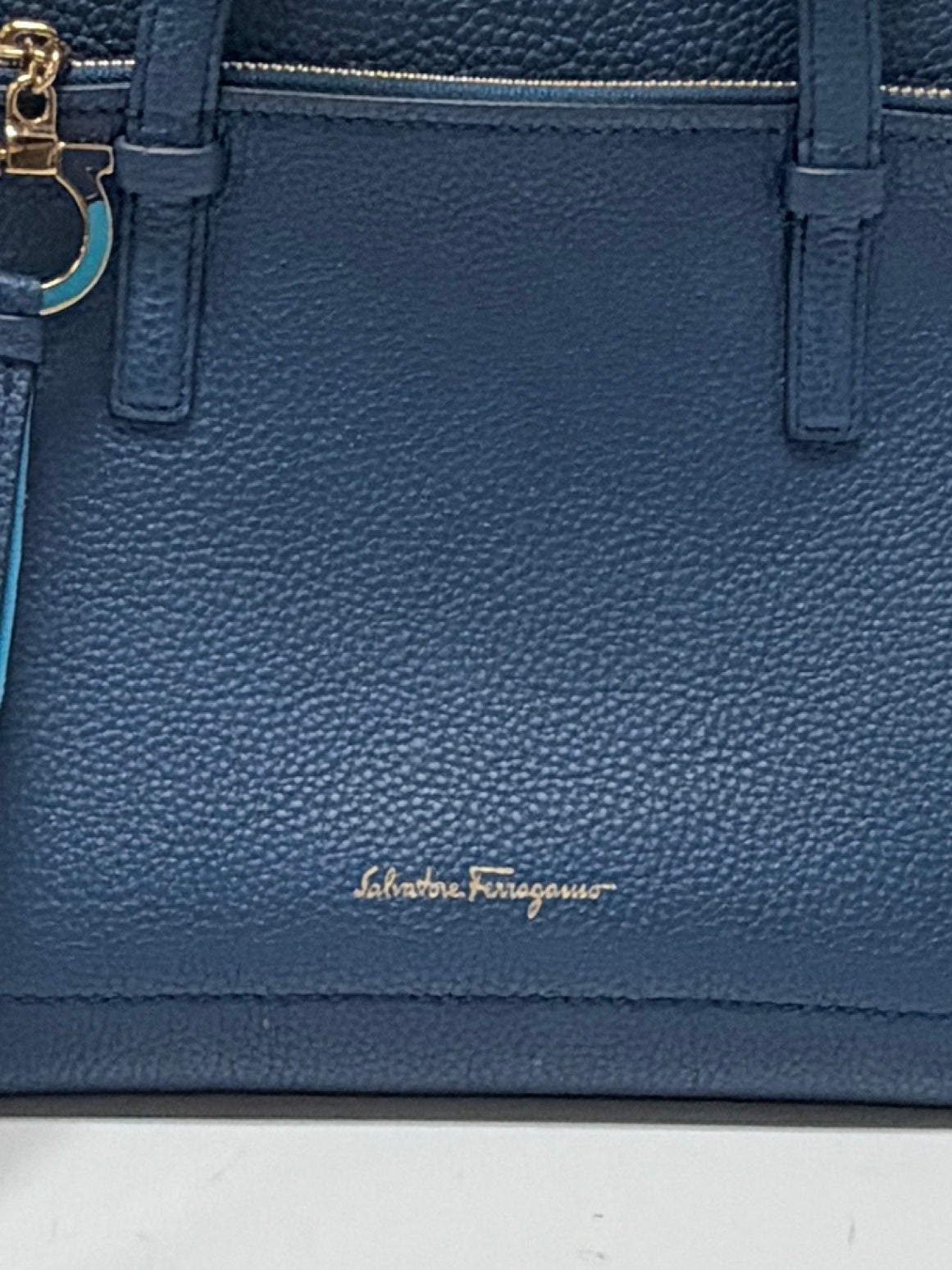 Lynn's Closet Boutique Salvatore Ferragamo Amy small blue pebbled leather tote bag with gold Gancini charm detail