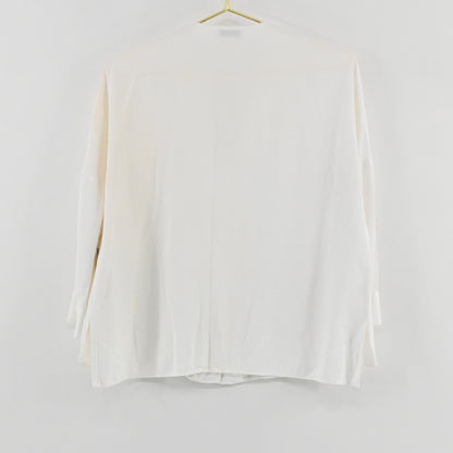 Lynn's Closet Boutique Sandro white long-sleeve top hanging on a gold hanger, back view showing a relaxed silhouette.