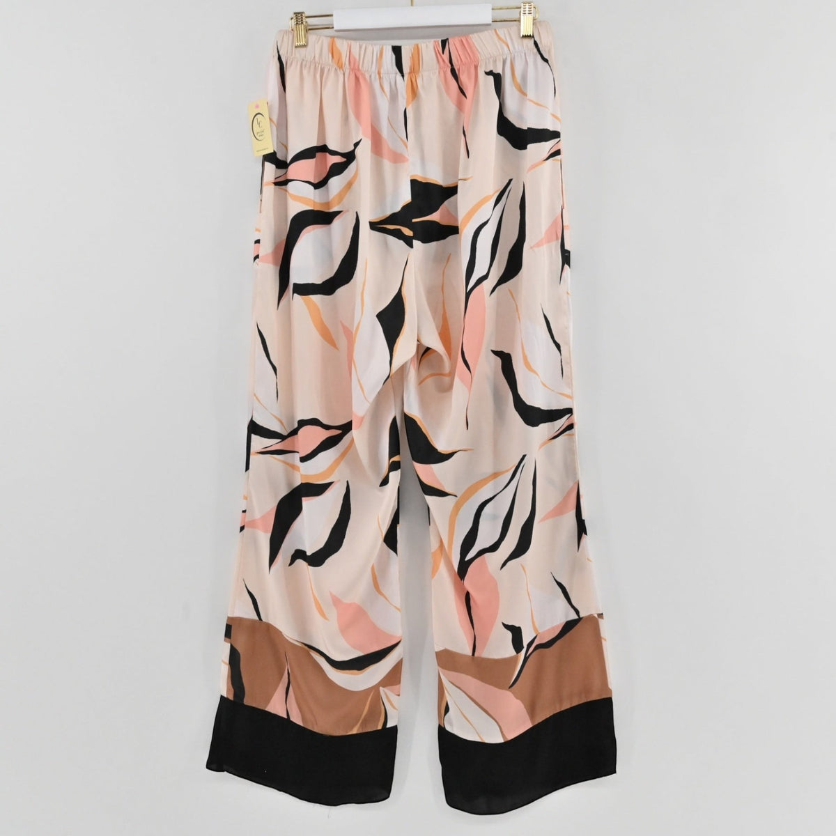 Lynn's Closet Boutique Amour781 satin wide leg pants with abstract leaf print in blush, tan, and black with hem border.