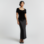 Model wearing a vintage Lynn's Closet Boutique black velvet jacket with a scalloped neckline and fabric-covered buttons.