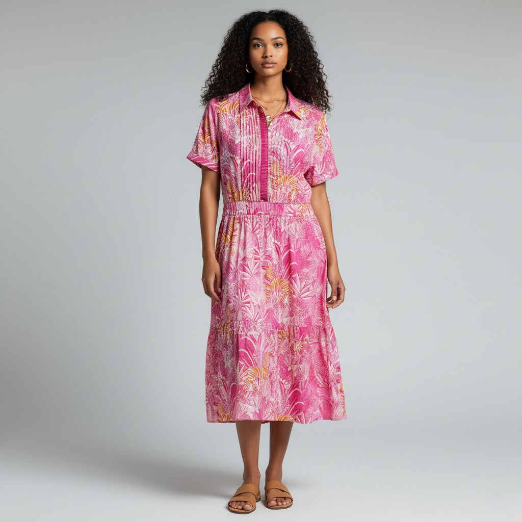 Model wearing Lynn's Closet Boutique Sheridan French bubblegum pink zebra print midi dress with short sleeves.