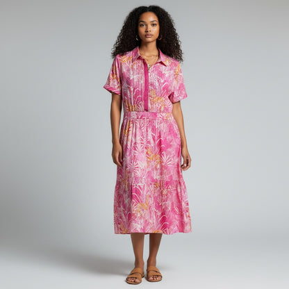Model wearing Lynn's Closet Boutique Sheridan French bubblegum pink zebra print midi dress with short sleeves.