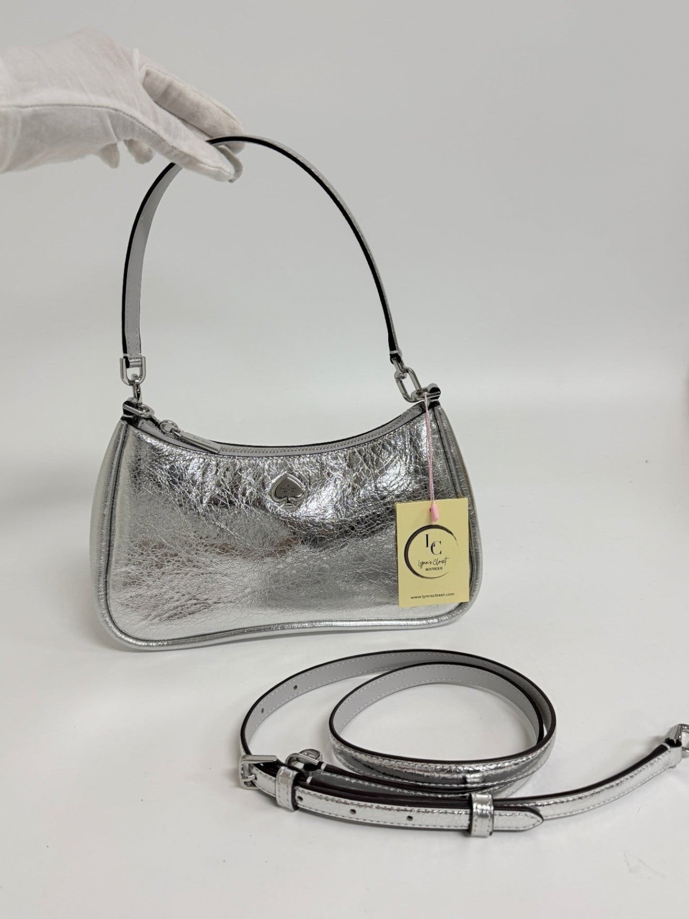 Lynn's Closet Boutique Kate Spade silver crinkle metallic shoulder bag with removable strap and spade logo hardware.