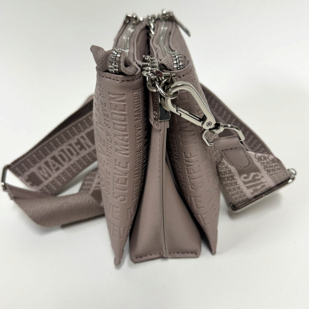 Lynn's Closet Boutique Steve Madden taupe crossbody bag with embossed logo, silver hardware, and branded strap.