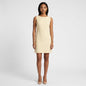 Model wearing a Steven Stolman butter yellow sleeveless shift dress with a boat neckline from Lynn's Closet Boutique.