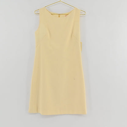 Lynn's Closet Boutique Steven Stolman butter yellow sleeveless shift dress with a boat neckline and textured fabric.
