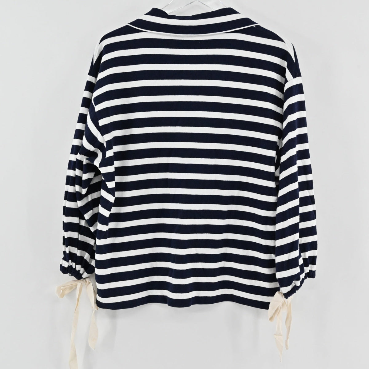 Lynn's Closet Boutique J.Crew navy and white striped knit popover with tie-cuff sleeves, back view.