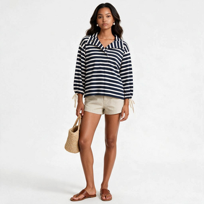 Lynn's Closet Boutique J.Crew navy and white striped snap-neck knit popover with tie-cuff sleeves on a model