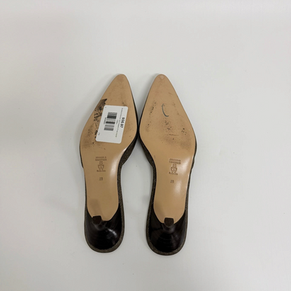 Lynn's Closet Boutique Stubbs & Wootton gold metallic mules showing the soles and kitten heels