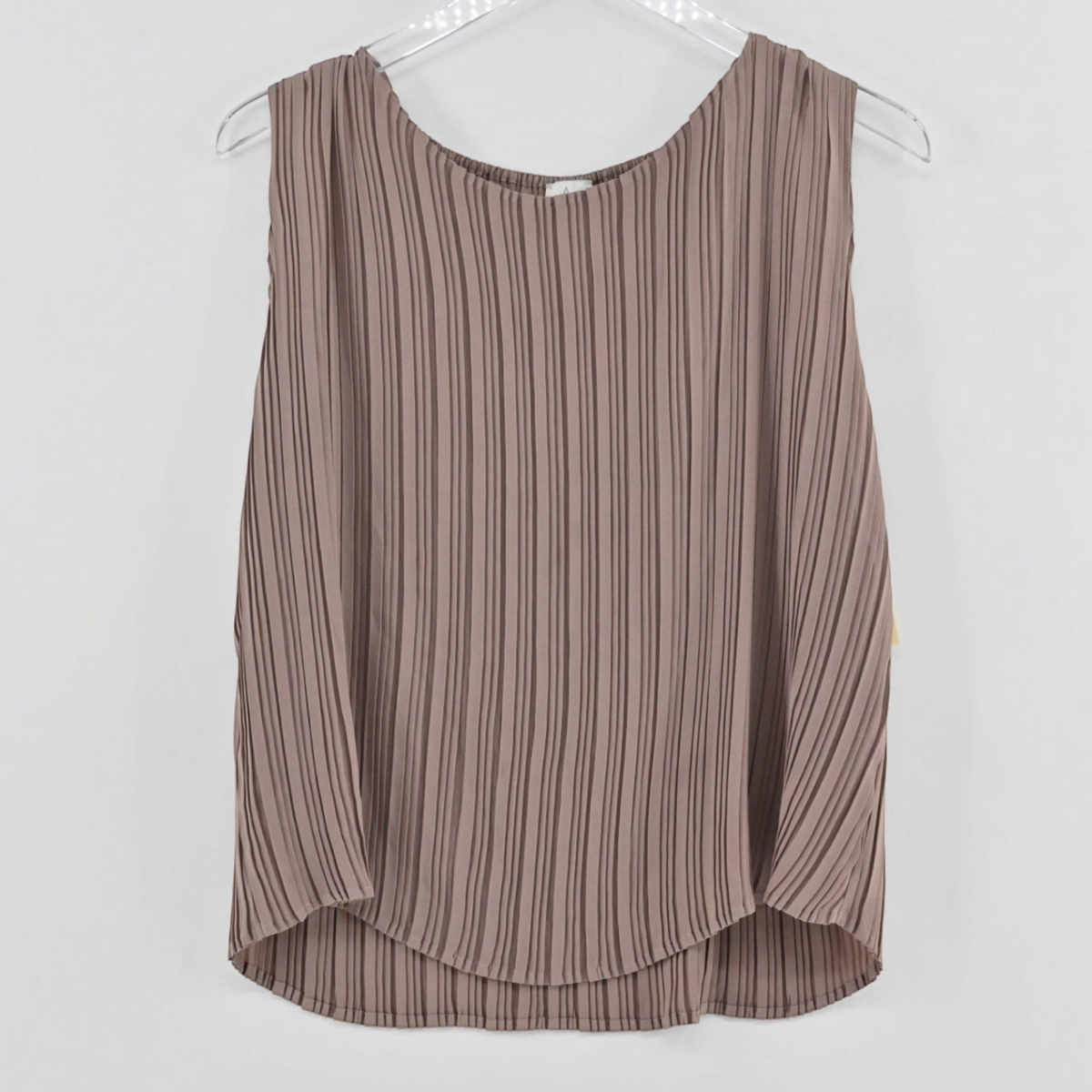 Lynn's Closet Boutique tan sleeveless pleated top with a relaxed silhouette and vertical texture