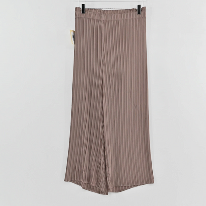 Lynn's Closet Boutique tan pleated wide-leg trousers with an elasticized waistband hanging on a clear hanger.