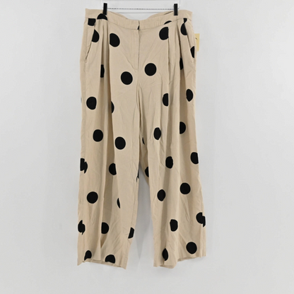 Lynn's Closet Boutique Tanya Taylor high-rise wide-leg pants in beige with oversized black polka dot print.