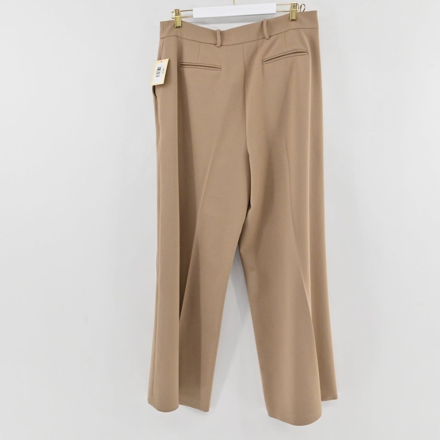Lynn's Closet Boutique Ted Baker tan wide-leg wool trousers hanging with back pockets and a clean waistband