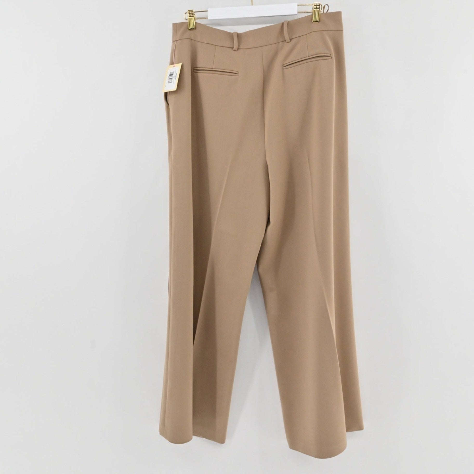 Lynn's Closet Boutique Ted Baker tan wide-leg wool trousers hanging with back pockets and a clean waistband