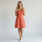Lynn's Closet Boutique terracotta mini dress with square neckline and wide straps, size M.