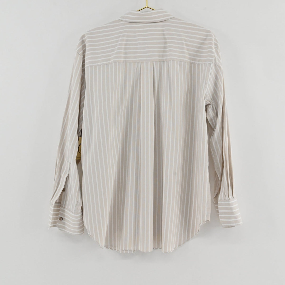 Back view of a Theory tan and white striped long-sleeve button-down shirt from Lynn's Closet Boutique.