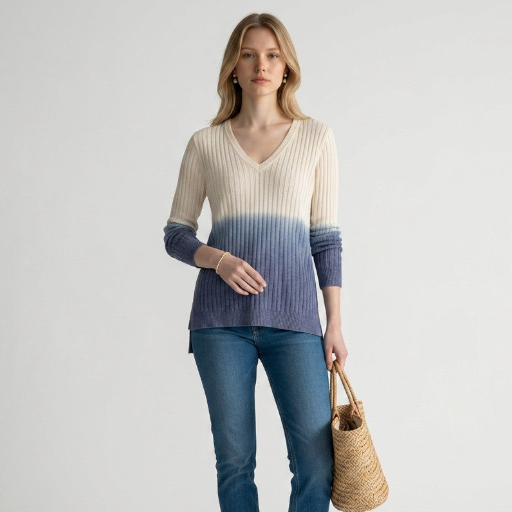 Lynn's Closet Boutique Tommy Bahama ombre alpaca sweater in cream and blue with a V-neck, worn with jeans and wedges.