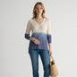 Lynn's Closet Boutique Tommy Bahama ombre alpaca sweater in cream and blue with a V-neck, worn with jeans and wedges.