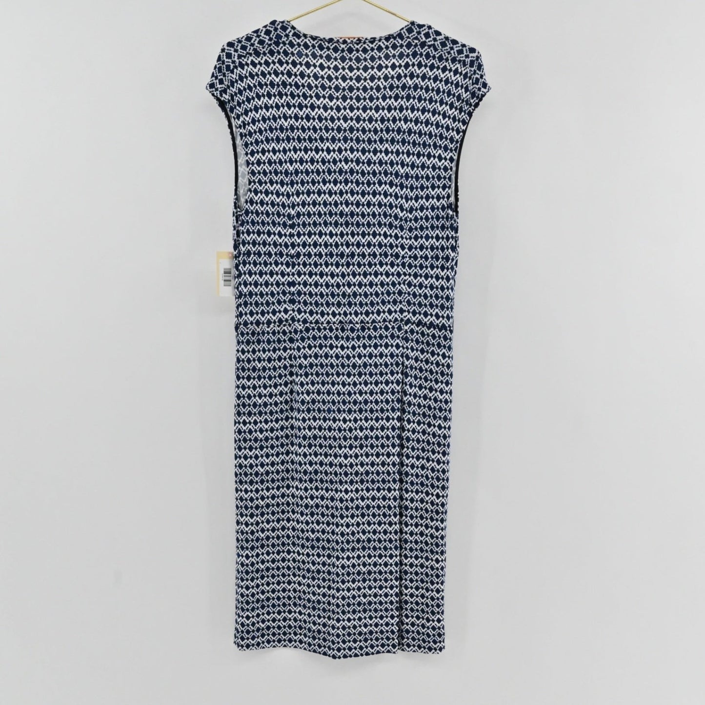 Lynn's Closet Boutique Tory Burch navy and white diamond print sleeveless dress with a V-neckline, back view.