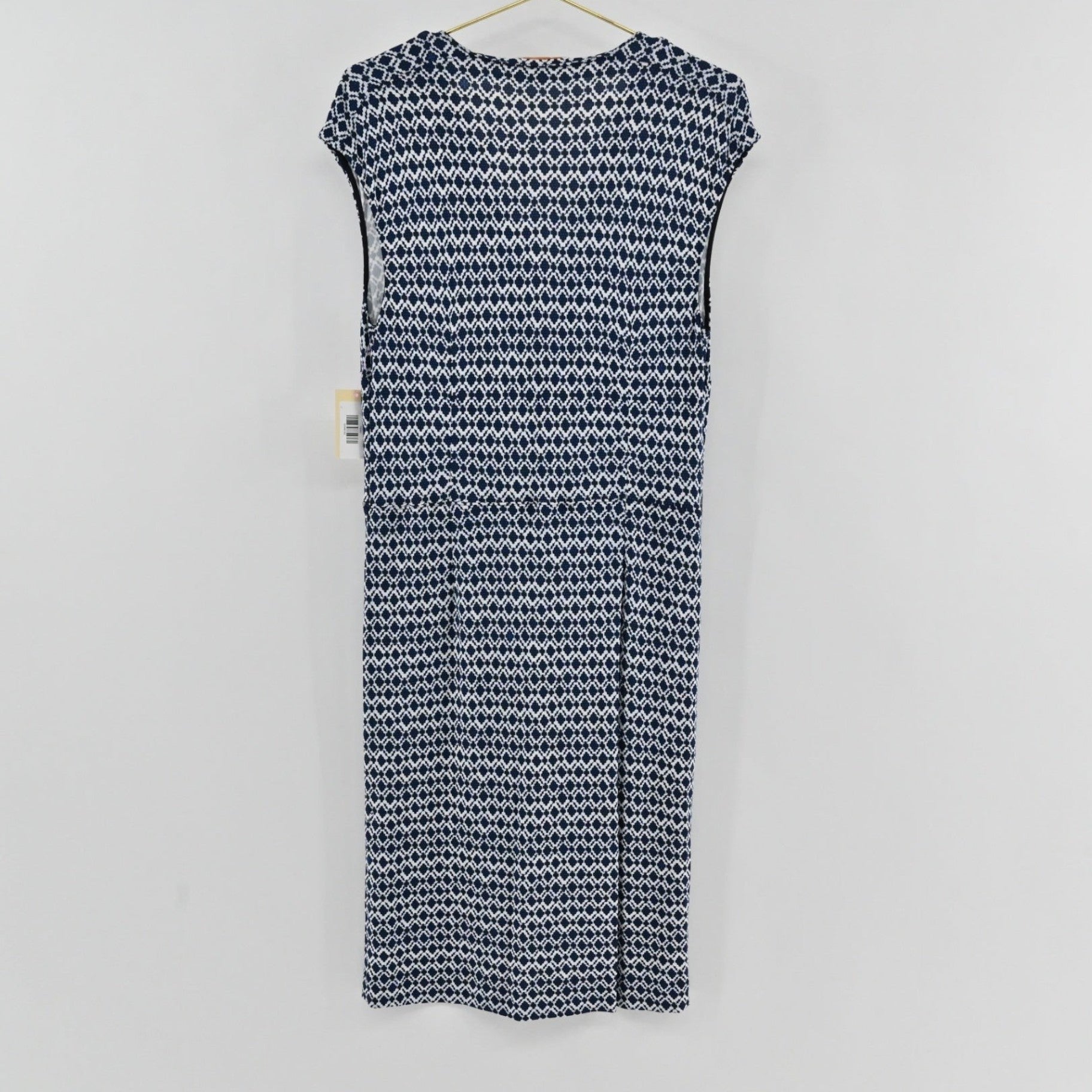 Lynn's Closet Boutique Tory Burch navy and white diamond print sleeveless dress with a V-neckline, back view.