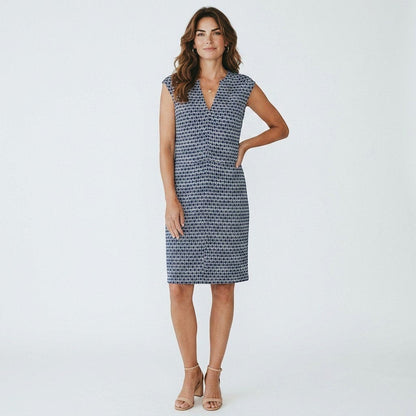 Lynn's Closet Boutique Tory Burch navy and white diamond print V-neck dress worn by a model with beige heels