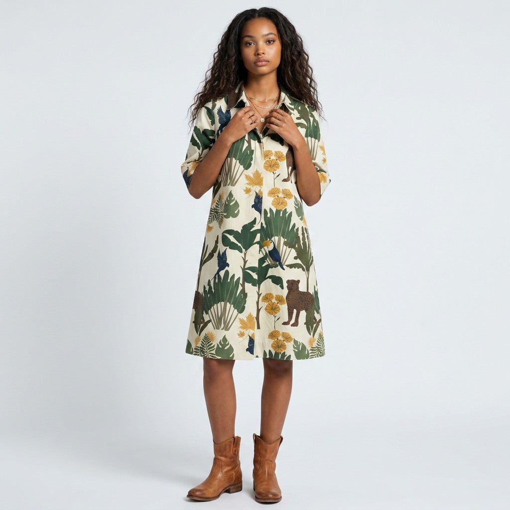 Model wearing a Lynn's Closet Boutique Just Darviny Oberoi dress with a cream base and tropical animal print