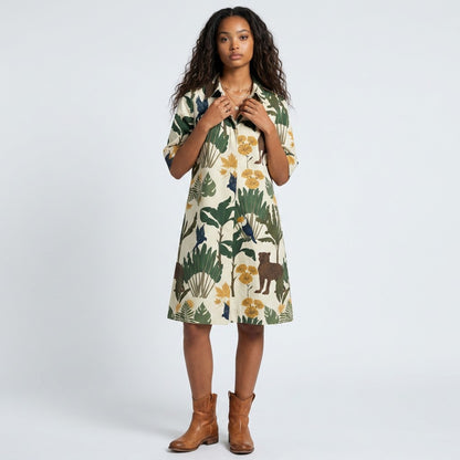 Model wearing a Lynn's Closet Boutique Just Darviny Oberoi dress with a cream base and tropical animal print