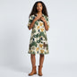 Model wearing a Lynn's Closet Boutique Just Darviny Oberoi dress with a cream base and tropical animal print