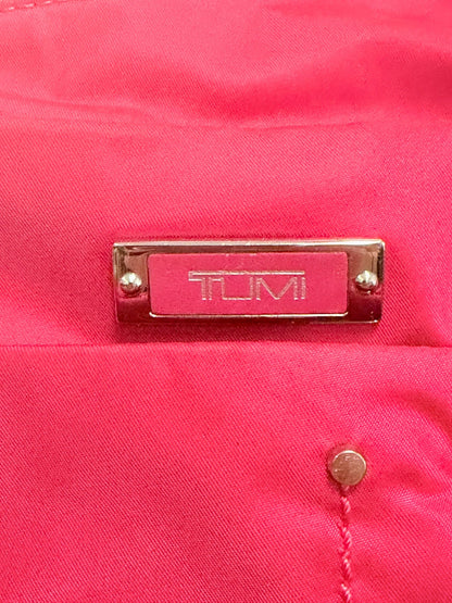 Lynn's Closet Boutique Tumi Voyageur hot pink nylon crossbody bag featuring a silver metal logo plaque detail.