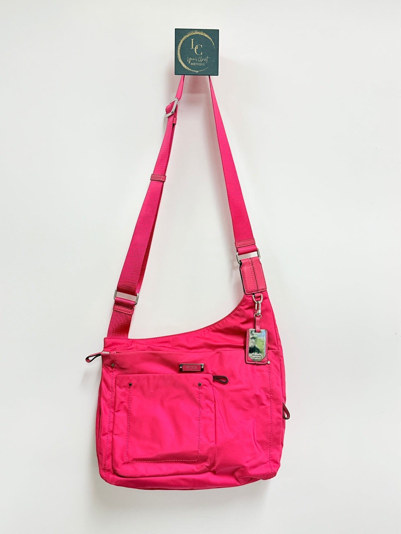 Lynn's Closet Boutique Tumi Voyageur hot pink nylon crossbody bag with adjustable strap and front zip pocket