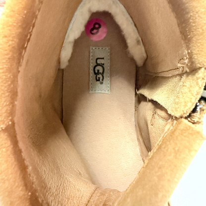 Interior view of Lynn's Closet Boutique UGG brown suede moccasin boot showing size 8 label and plush lining