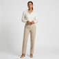 Model wearing Lynn's Closet Boutique vintage Valentino Roma ivory straight-leg trousers with a silk blouse.