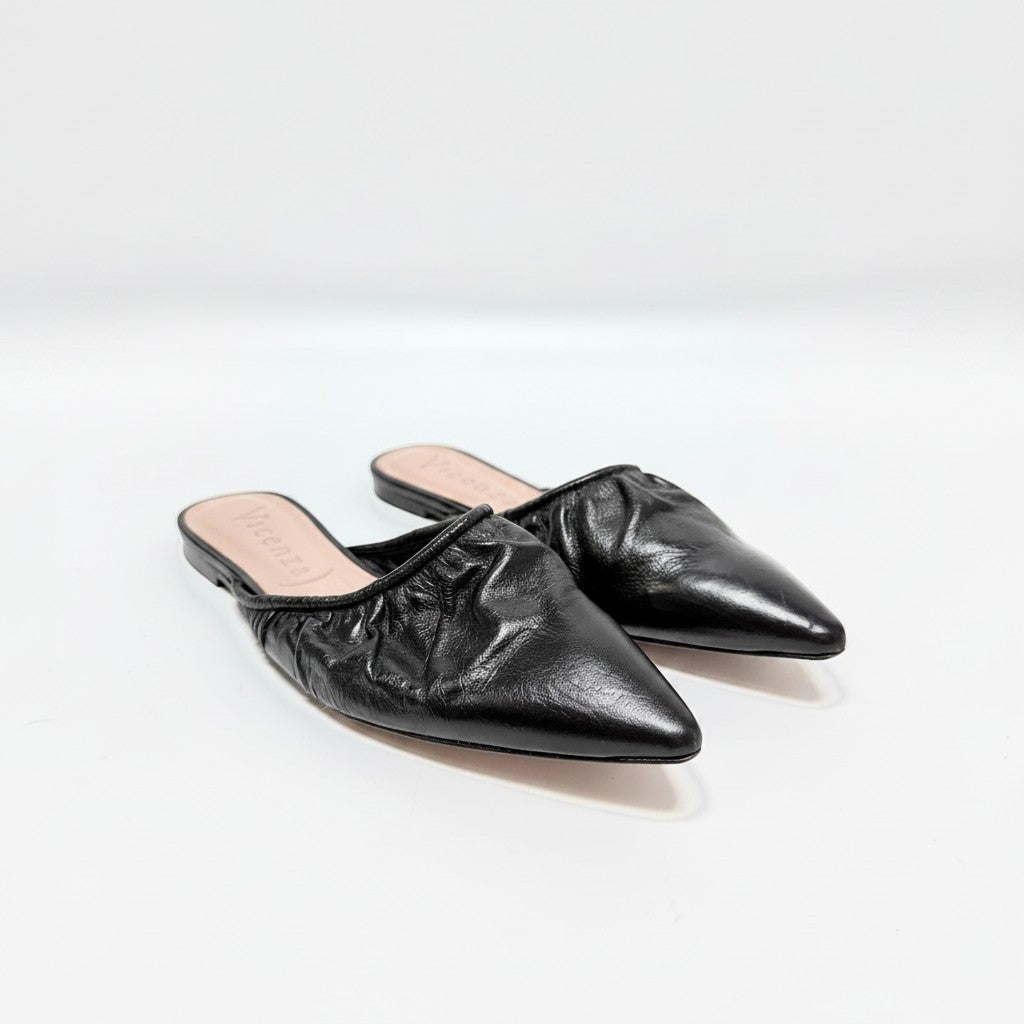 Lynn's Closet Boutique Vicenza black leather mules with a pointed toe and ruched detailing on a white background.