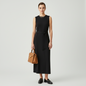 Model wearing a black sleeveless Vince midi dress with a tied sash waist from Lynn's Closet Boutique