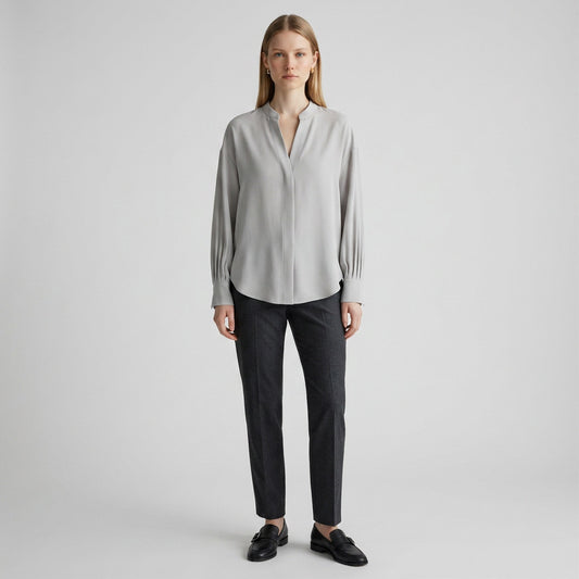 Lynn's Closet Boutique Vince gray satin blouse with V-neck, long sleeves, and tailored cuffs on a model.