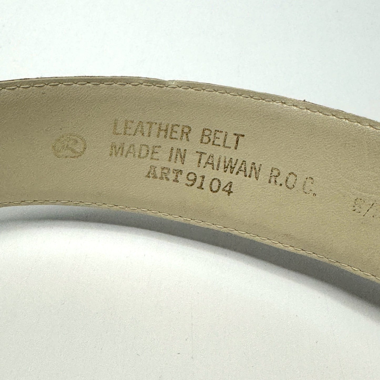 Lynn's Closet Boutique vintage ostrich-embossed leather belt interior label showing origin and material details