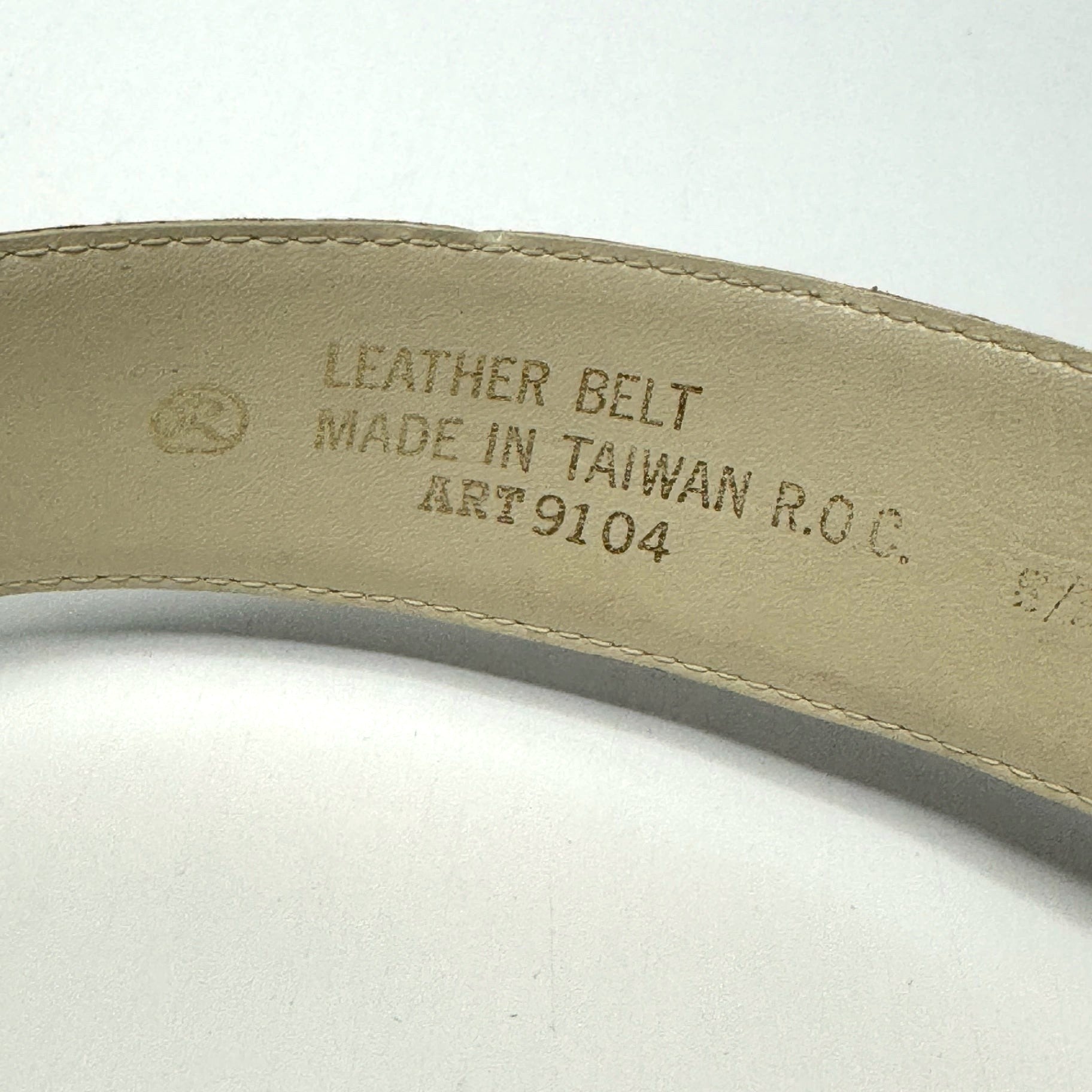 Lynn's Closet Boutique vintage ostrich-embossed leather belt interior label showing origin and material details