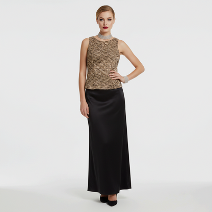 Model wearing a Lynn's Closet Boutique vintage CMV brown and tan sequin sleeveless top with a black maxi skirt.