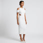Model wearing a Lynn's Closet Boutique French Connection white midi dress with cold-shoulder cutouts and waist detail.