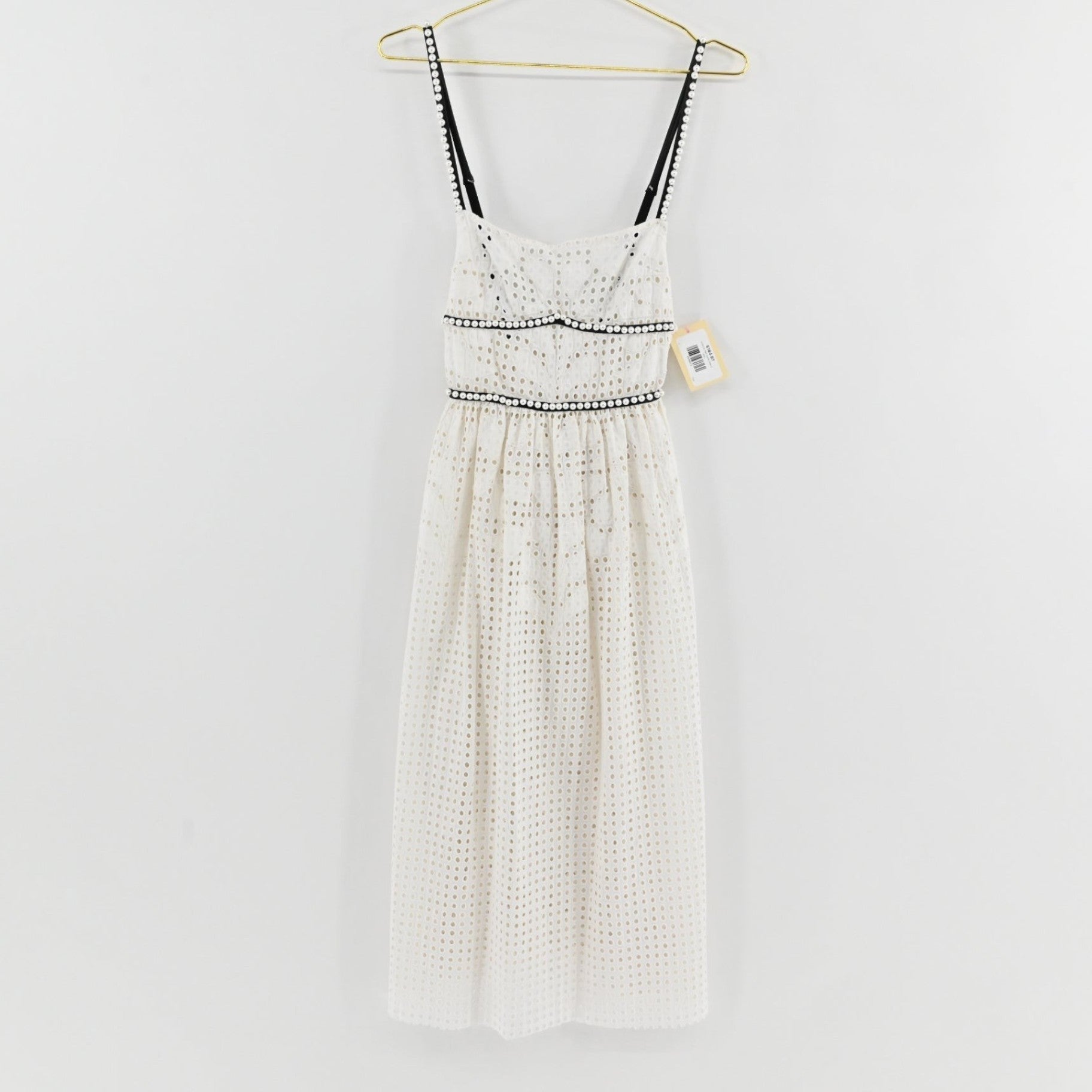 Lynn's Closet Boutique white midi eyelet dress with black trim and faux pearl accents on straps and waist