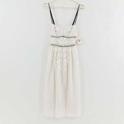 Lynn's Closet Boutique white midi eyelet dress with black trim and faux pearl accents on straps and waist