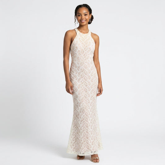 Model wearing a Lynn's Closet Boutique white lace floor-length gown with a high neckline and fitted silhouette.