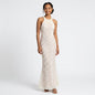 Model wearing a Lynn's Closet Boutique white lace floor-length gown with a high neckline and fitted silhouette.