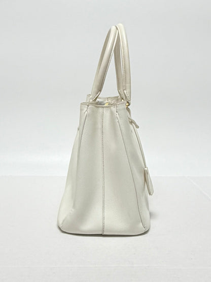 Lynn's Closet Boutique white Prada Galleria Saffiano leather medium handbag, side view showing structured silhouette.