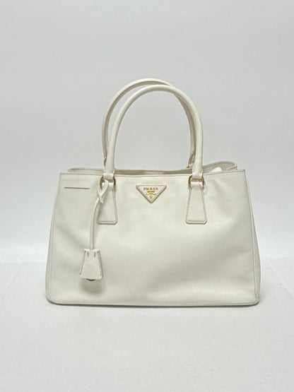 Lynn's Closet Boutique white Prada Galleria medium handbag in Saffiano leather with gold-tone hardware and logo plaque.