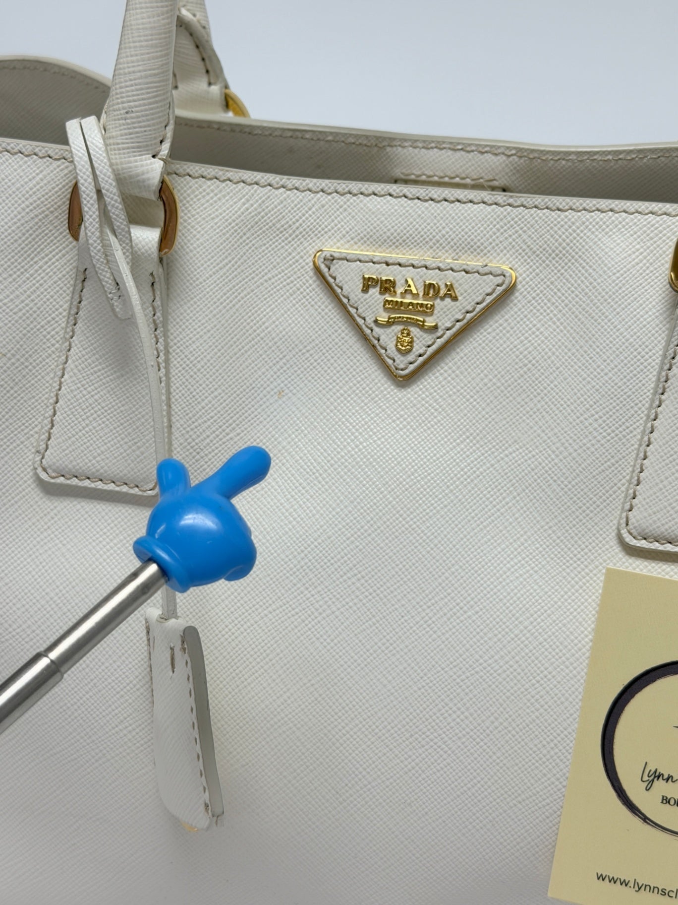 Lynn's Closet Boutique white Prada Galleria Saffiano leather handbag with gold logo plaque and top handle detail